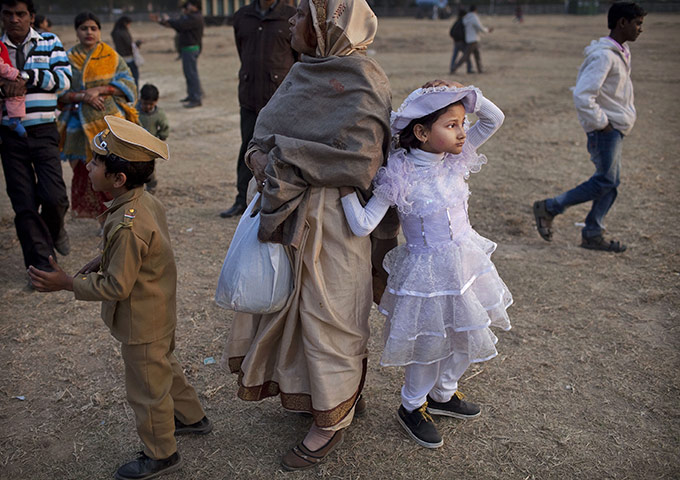 24 hours in pictures: An Indian girl wears a fancy dress at the India Gate monument 