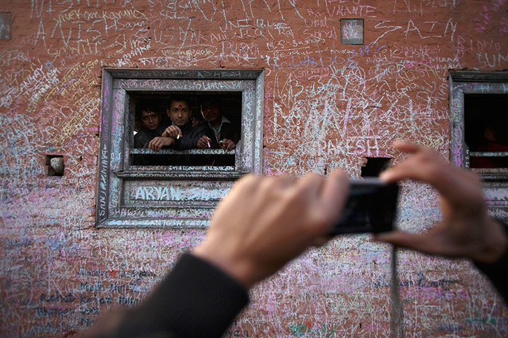24 Hours: A devotee takes a picture of his friends at the Saraswati temple