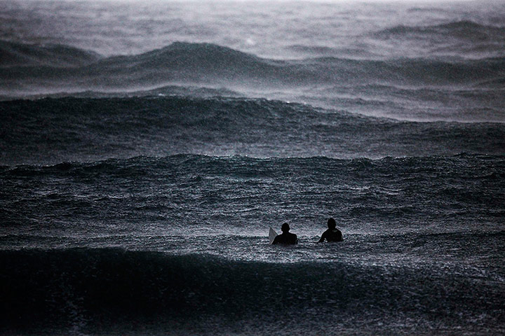 24 Hours: Surfers wait to catch a wave in the Mediterranean Sea