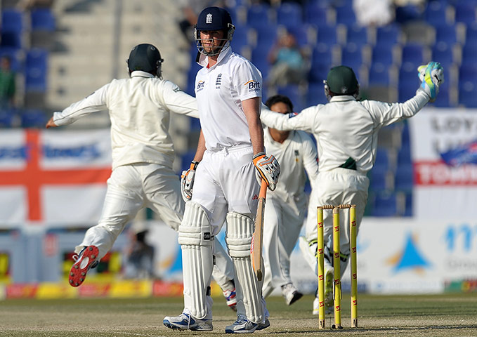 England v Pakistan: England's Graeme Swann walks back to the pavilion after he was dismissed