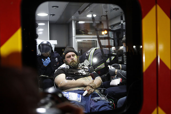 Occupy Oakland: A protestor receives medical attention in an ambulance after being arrested