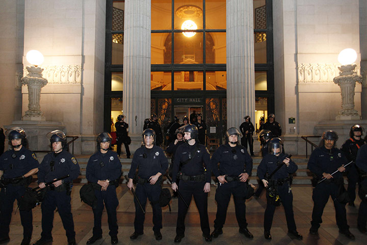 Occupy Oakland: Police officers protect the Oakland City Hall 