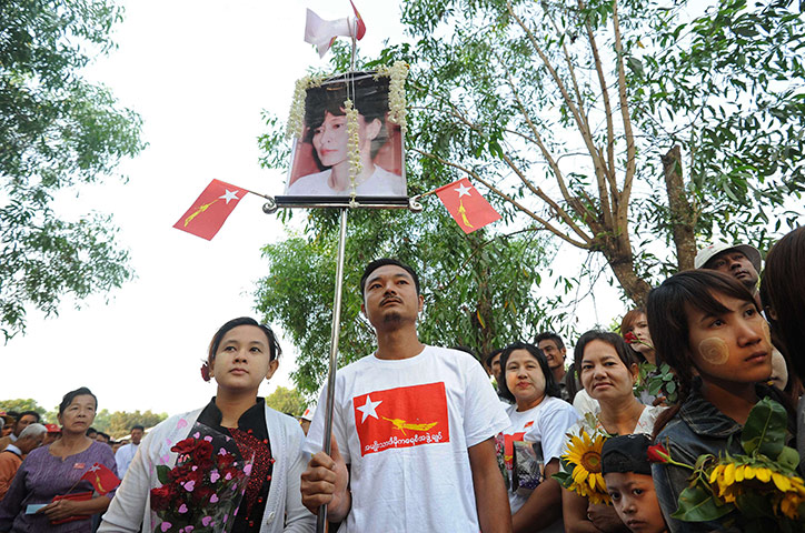 Aung San Suu Kyi campaign: A supporter holds up a picture of Aung San Suu Kyi