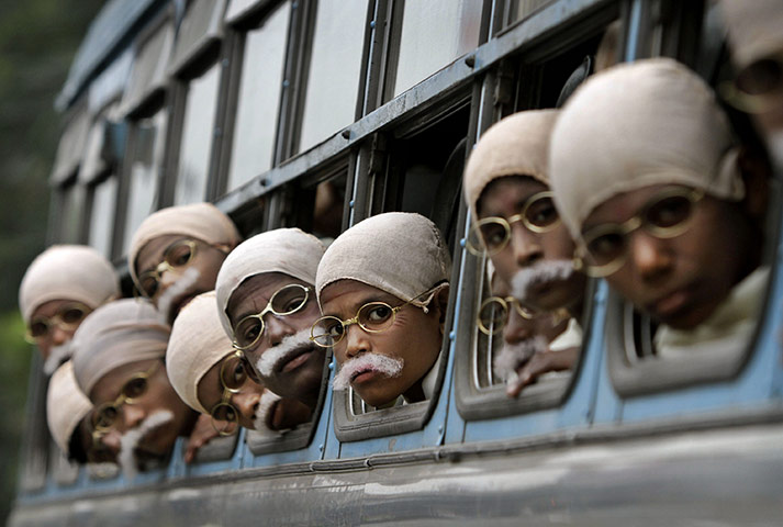 Gandhi world record event: Children arrive on a bus before attempting a world record in Calcutta