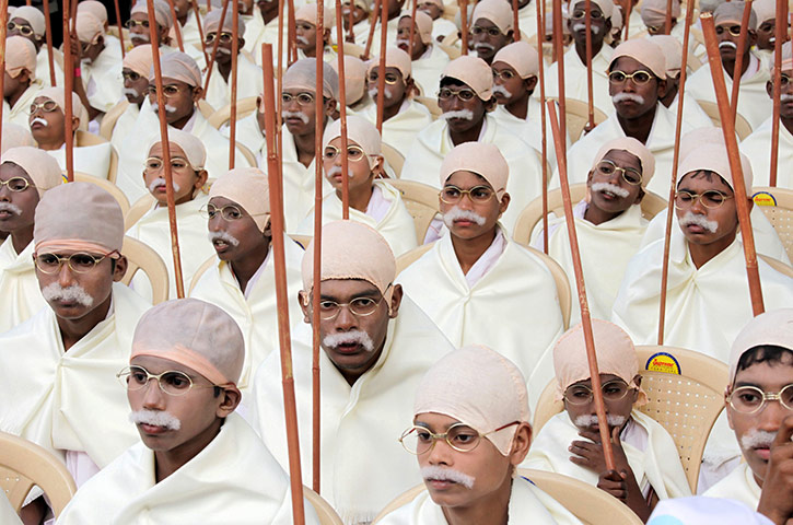 Gandhi world record event: Indian boys dressed as Mahatma Gandhi take part in a peace rally 