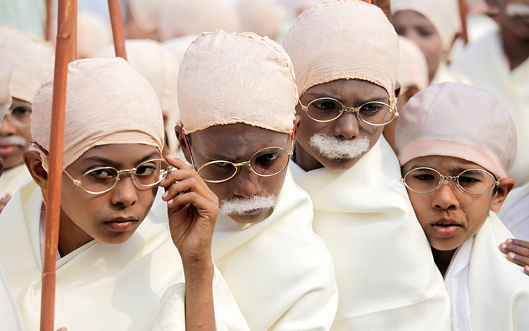 Gandhi world record event: Indian boys dressed as Mahatma Gandhi participate in a peace rally