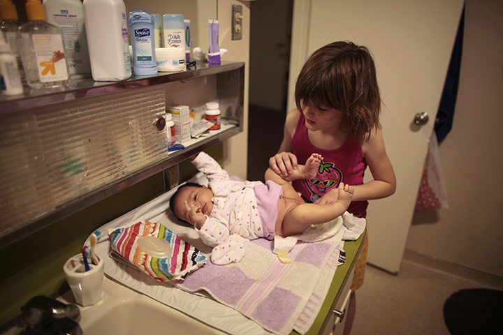 Hope Gardens : Lilly Earp changes the diaper of her sister Emily