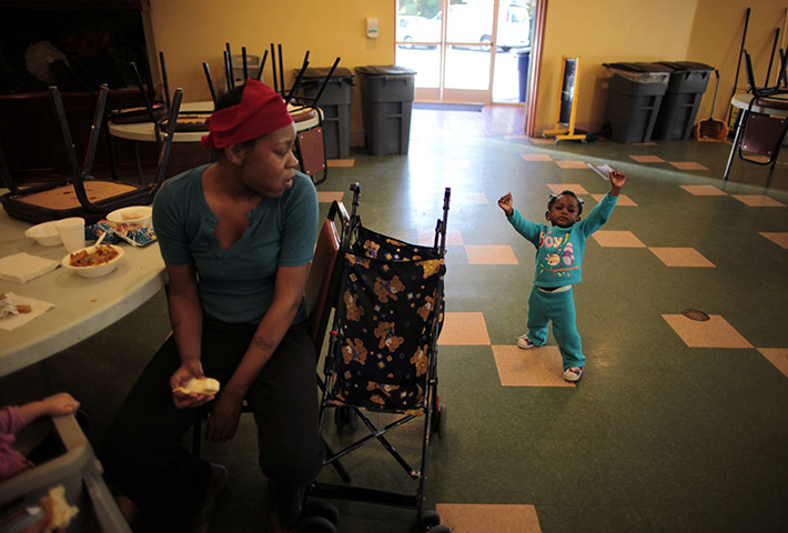 Hope Gardens : Denise Bowie watches her one year old daughter Genelle walking