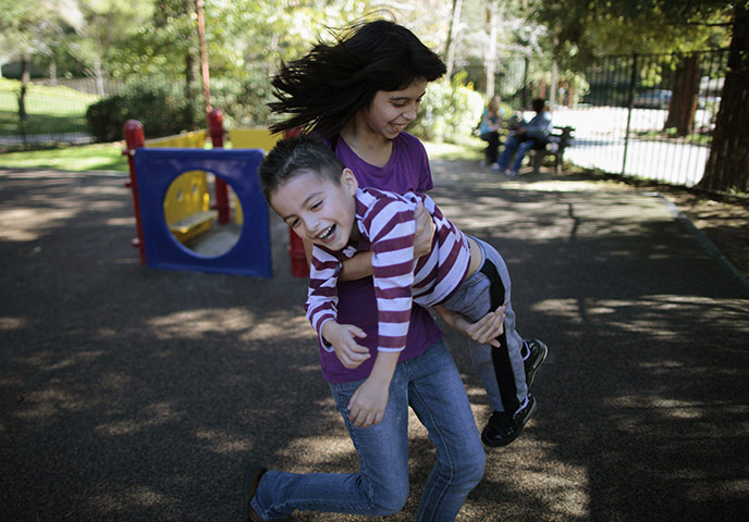 Hope Gardens : Daniella Flores carries her brother Brandon Flores