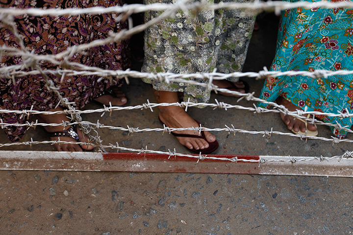 24 hours in pictures: Family of prisoners wait for them to come out from Insein prison, Burma