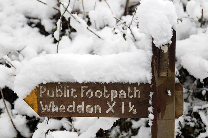UK weather: Snow covers signage for a footpath near Wheddon Cross