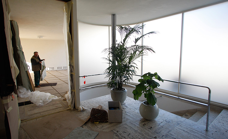 Villa Tugendhat: A worker makes last final preparations inside the villa 