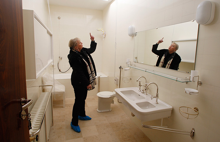 Villa Tugendhat: Iveta Cerna, architect, points at details in the bathroom 