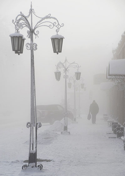 World weather: A pedestrian walks along a snow-covered street in Pavlodar, Kazakhstan