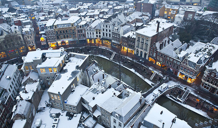 World weather: Houses in the old centre of Utrecht are covered with snow, The Netherlands