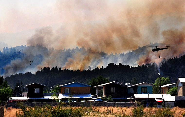 Chile forest fire: Helicopters fight a massive forest fire affecting the commune of Quillon
