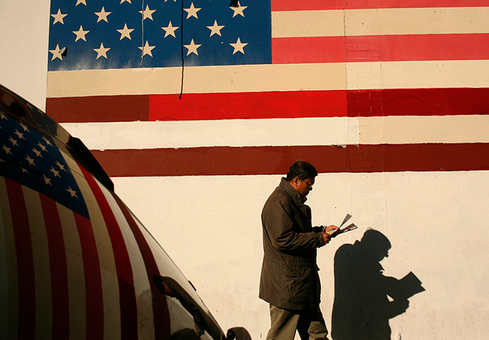 24 hours in pictures: A man walks in the Chinatown area of San Francisco