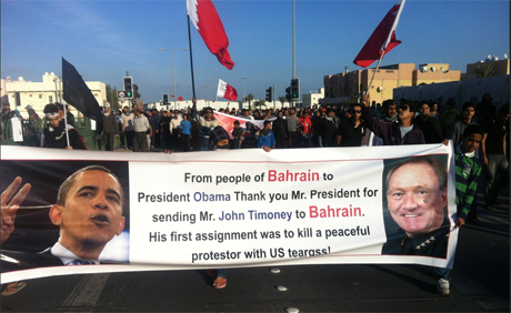Bahrain protesters hold Obama and Timoney banner