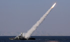 The Iranian navy fires a Mehrab missile in the Strait of Hormuz
