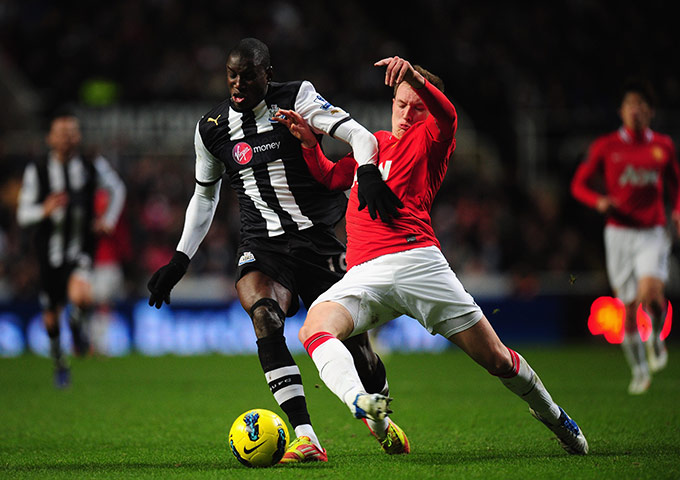 Wednesday Footie: Newcastle United's Demba Ba is tackled by Manchester United's Phil Jones