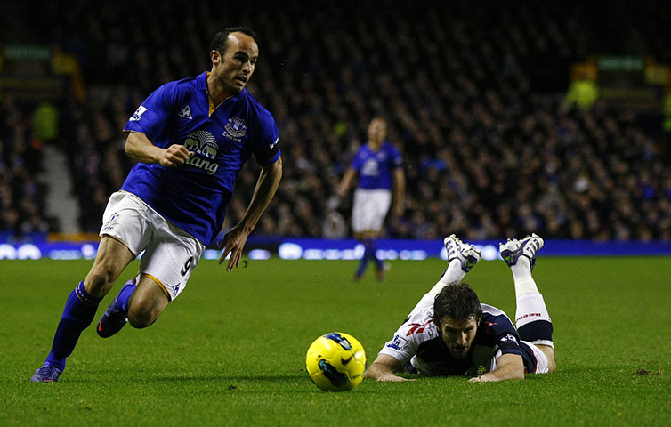 Wednesday Footie: Everton's Landon Donovan skips past a flailing Sam Ricketts of Bolton