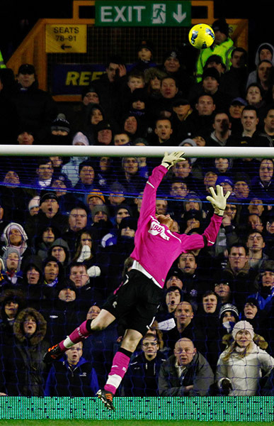 Wednesday Footie: Bolton Wanderers' Adam Bogdan concedes a goal by Everton keeper Tim Howard