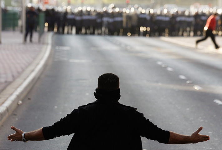 24 hours in pictures:  An anti-regime protester in Bahrain
