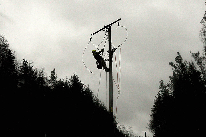 UK weather: Scottish Power, work on a broken overhead power line in Cumbernauld