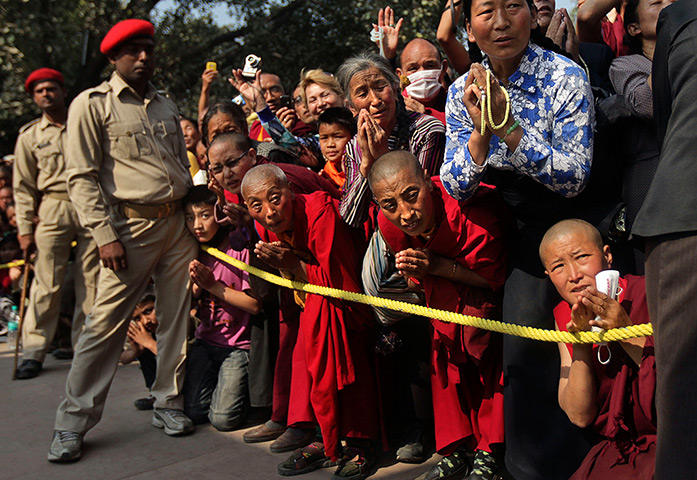 FTA: Altaf Qadri: Buddhist monks and other devotees wait to welcome the Dalai Lama