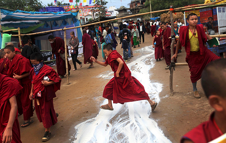 FTA: Altaf Qadri: A young Buddhist monk jumps over spilled tea