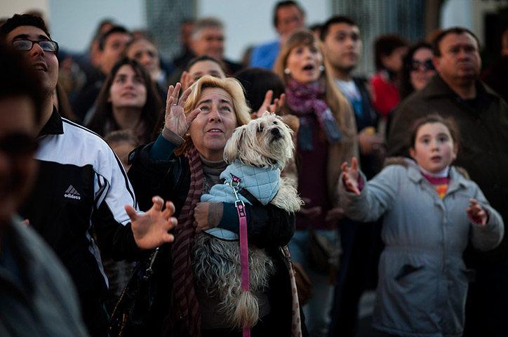 Epiphany: People collect sweets being thrown during the Cabalgata de Reyes