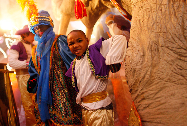 Epiphany: A boy winks as he takes part in the traditional Epiphany parade in Malaga