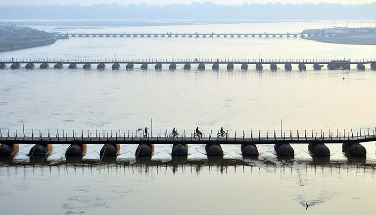 24 Hours: A temporary bridge made for Magh Mela festival on the Ganga River, India