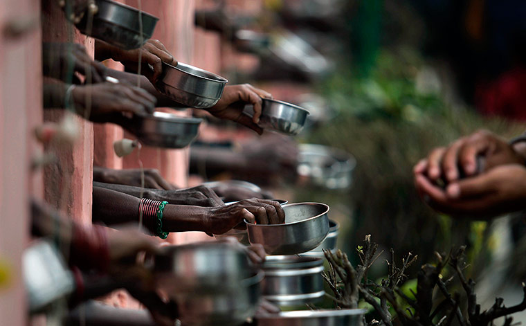 24 Hours: Indian beggars ask for alms from Buddhist devotees at the Mahabodhi temple