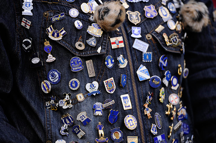 Everton v Tamworth: Everton fan with badges