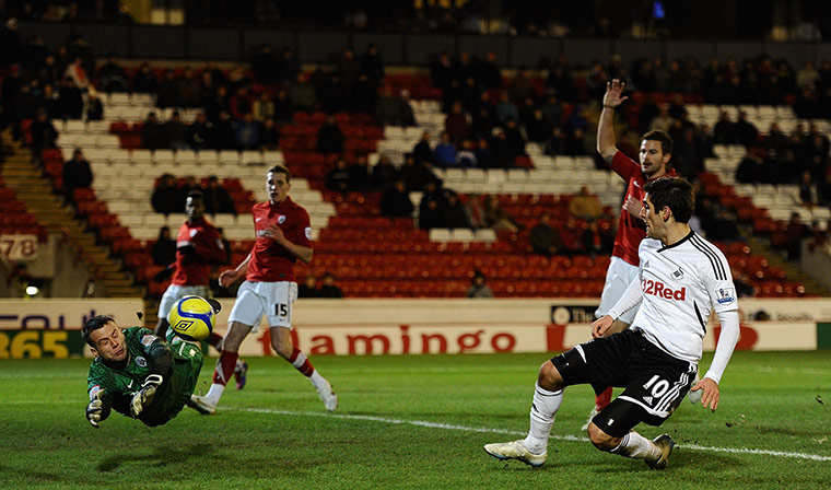 Magic of the Cup: Danny Graham slots Swansea's third goal past the diving Luke Steele