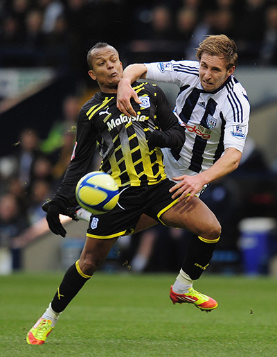 FA Cup Round-up: Robert Earnshaw of Cardiff City is challenged by Craig Dawson of West Brom
