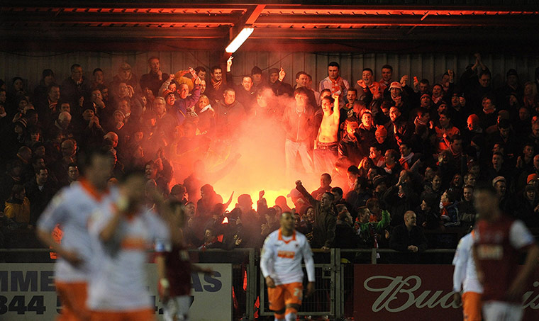 FA Cup Round-up: Blackpool fans set of flares as they celebrate a goal against Fleetwood