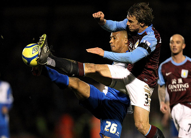 FA Cup Round-up: Aston Villa's Stephen Warnock and Bristol Rovers' Chris Zebroski tussle