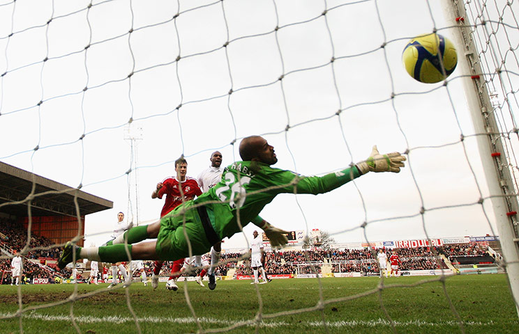 FA Cup Round-up: Swindon Town's Alan Connell heads a goal against Wigan Athletic