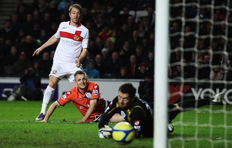 FA Cup Round-up: Dean Bowditch of MK Dons scores against Queens Park Rangers