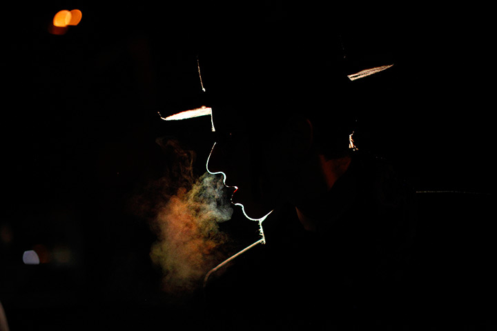 24 hours in pictures: A demonstrator  outside the republican debates in New Hampshire 