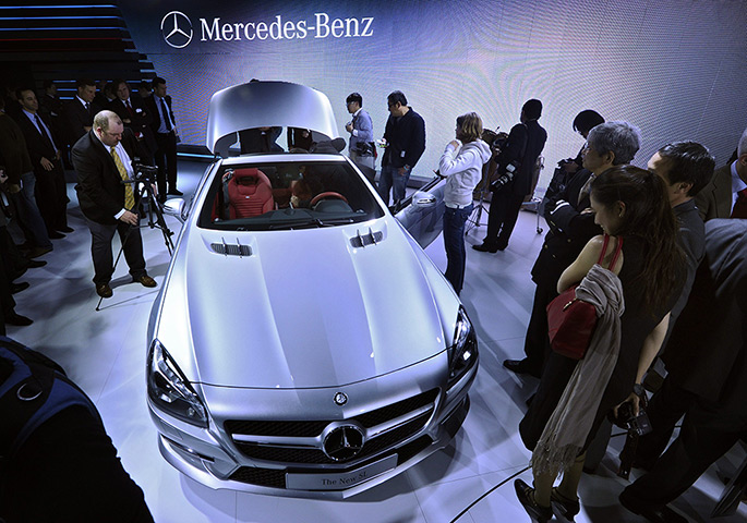 International Auto Show: People look at one of the new Mercedes-Benz SL line of cars