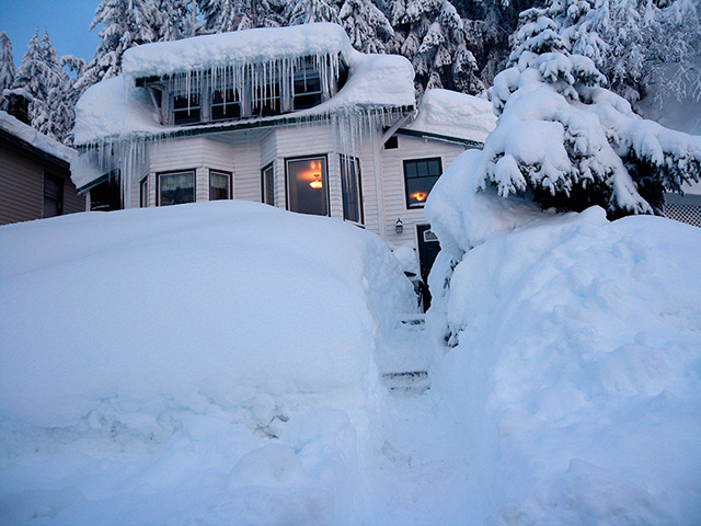 24 hours: Cordova, Alaska: A house is buried in snow