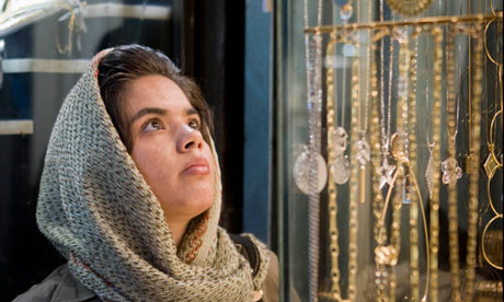 An Iranian woman browses in a gold shop