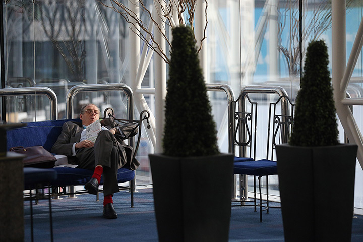 Sleeping delegates: A delegate relaxes on the third day of the Conservative party conference 