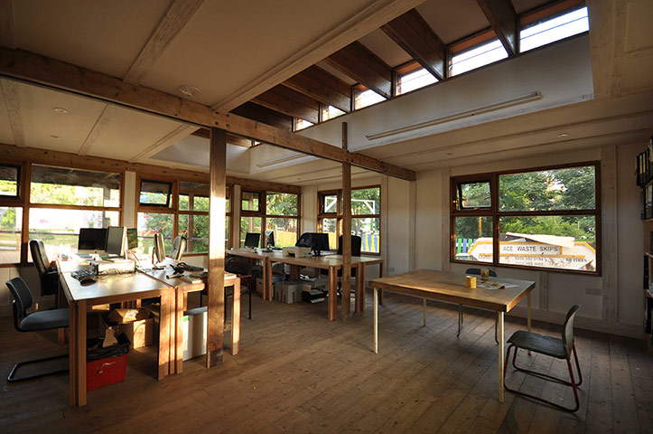 Oasis Childrens' Venture: A bright and airy office space with exposed wooden beams