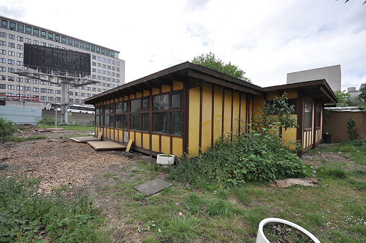 Oasis Childrens' Project: A single story building sits on a scruffy plot of land