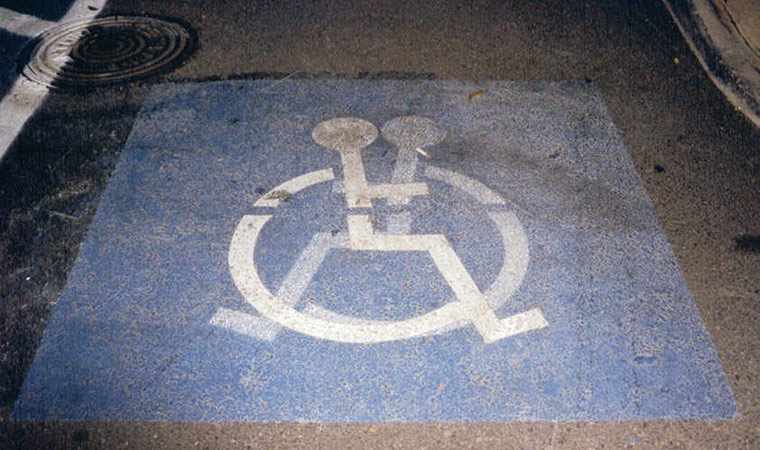 Your Pictures: Signs: Disabled parking sign with the previous faded symbol in the reverse