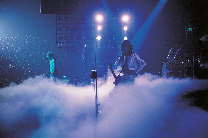 Led Zeppelin: Dry ice fills the stage as Jimmy Page plays a theramin in 1977